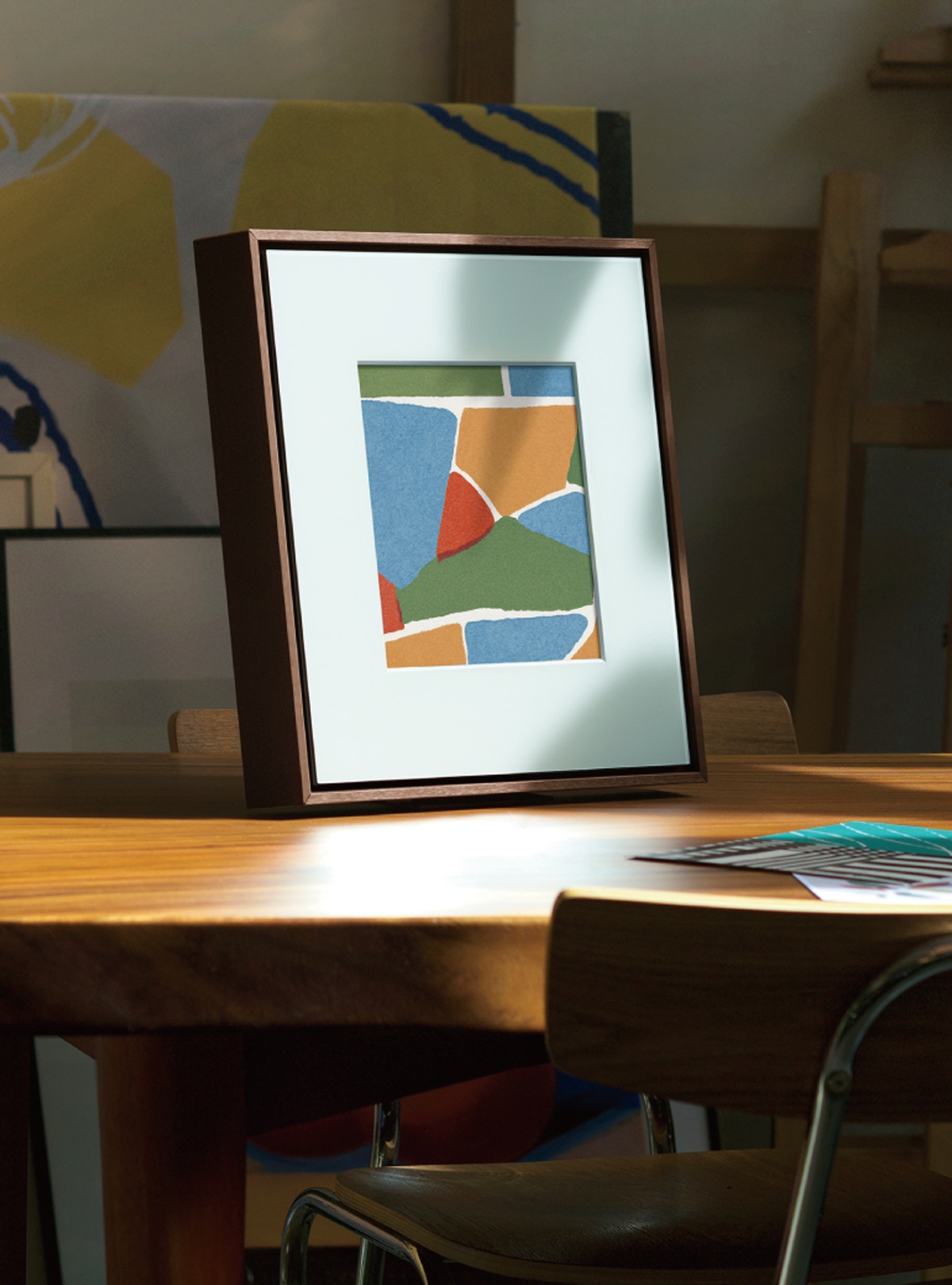 The cover of the MusicFrame has an image with the colors light blue, red, yellow, and chartreuse embedded in it.